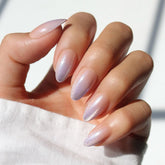 Glamnetic Polar Day nails in almond shape with ombre lilac tips for chic wear