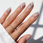Glamnetic WOO-MAN gray short almond nails with velvet cat-eye finish for salon-quality at home.