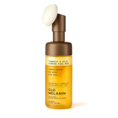 Glo Melanin Turmeric & Kojic Foaming Wash top view showing gentle exfoliation for brighter skin.