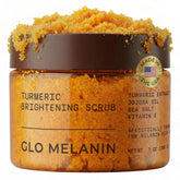 Glo Melanin turmeric scrub bottle close-up for natural exfoliation and radiant skin.