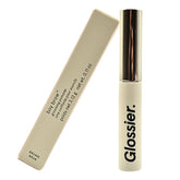 Glossier Boy Brow brown jar showing volumizing formula for fuller, natural brows.