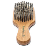 GranNaturals hard bristle brush for dense hair smoothing and detangling.
