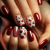 Uñas postizas GRITOSE con corazones rojos y glitter para un look romántico