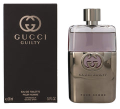Gucci Guilty bottle with wood-grain accents and black cap.