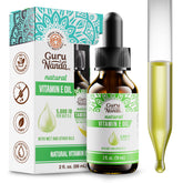 GuruNanda Vitamin E Oil bottle pour for smooth, hydrating skin care.