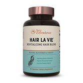 Hair La Vie Live Conscious bottle label highlights vitamins for healthier hair growth.
