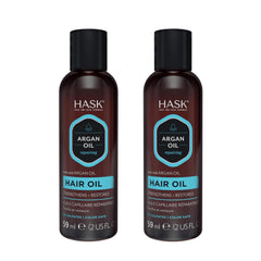 Aplicación en cabello seco con aceite reparador de argán HASK para brillo.