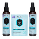 HASK Argan Oil 5-in-1 Leave-In Spray bottle on counter for detangling and shine.