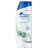 Head & Shoulders Itchy Scalp Care bottle pour with cooling relief and dandruff protection.