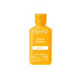 Hempz Citrus Blossom crema corporal en botella para hidratación prolongada.