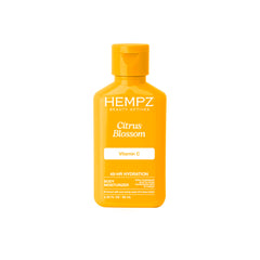 Hempz Citrus Blossom crema corporal en botella para hidratación prolongada.
