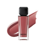 HERA Sensual Nude Gloss Brownie Boy cap application shows natural, sheer color