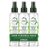 Gel en aerosol Herbal Essences para rizos, definición duradera y aroma suave.