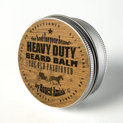Close-up of Honest Amish Heavy Duty Beard Balm tin for taming unruly hairs.