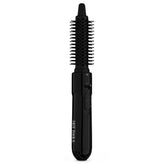 Hot Tools Pro Artist hot air brush barrel close-up shows flexible bristles guiding hair for smooth styling.
