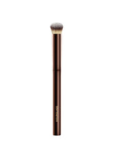 Hourglass Vanish Concealer Brush closeup shows half-moon shape for precise, seamless blending