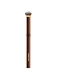 Hourglass Vanish Concealer Brush closeup shows half-moon shape for precise, seamless blending