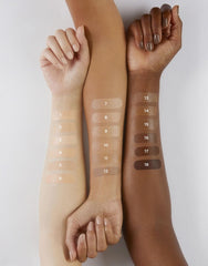 Hourglass Veil Hydrating Skin Tint on skin with a luminous finish in natural light.