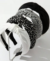 Diadema Huachi nudo negro para estilos elegantes duraderos.