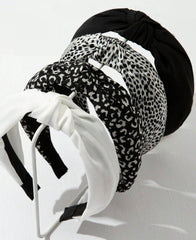 Diadema Huachi nudo negro para estilos elegantes duraderos.