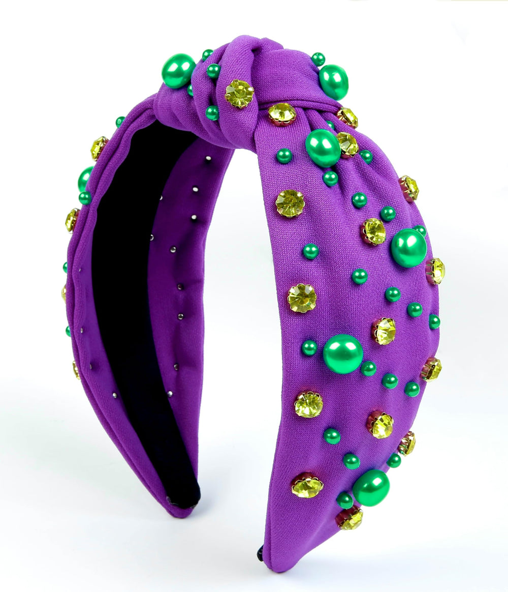 Diadema Huachi Mardi Gras con nudo morado y perlas verdes para fiesta.