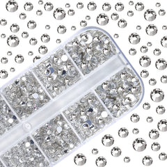 HUETFAT tweezers gripping rhinestones for quick nail art application.