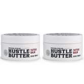 Hustle Butter Deluxe tattoo balm bottle closeup for smooth pre-ink prep.
