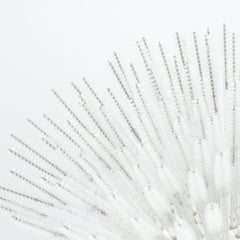i-Laesh close-up of spiral head brush delivering precise lash grooming.