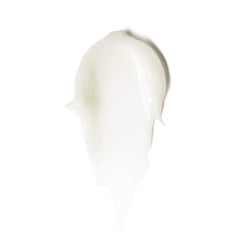 Close-up of ILIA Lip Wrap jar showing cushiony hydration and luxe texture.
