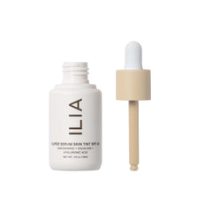 ILIA tint dispenser releasing a small drop for buildable coverage.