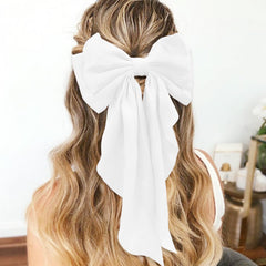 illpta oversized satin bow clip secures hair with stylish flair.