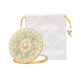 Imperblooms compact mirror with embossed detail adds vintage charm for easy purse spotting.