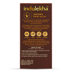 Indulekha Bringha Oil bottle closeup highlighting coconut oil base for silky hair.
