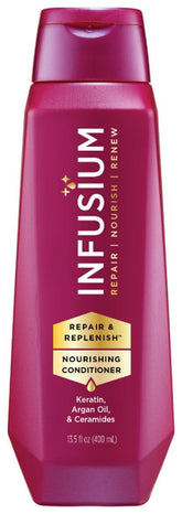 Infusium Repair and Replenish bottle pour showing deep hydration for hair