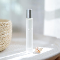 Close-up of the frosted roll-on bottle cap highlighting sea-inspired finish for travel