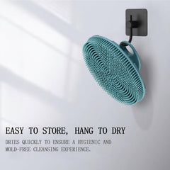 Dark green INNERNEED scrubber shows quick-drying, hygienic silicone surface.