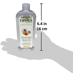 Applying Instituto Español Almond Body Oil on skin for quick absorption