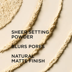 IT Cosmetics Bye Bye Pores pressed powder swatch blending across skin tones.