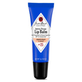 Jack Black bálsamo labial SPF25 pomelo-jengibre, aplicación suave para hidratación diaria.