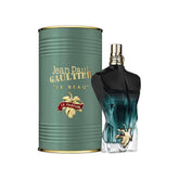 Jean Paul Gaultier Le Beau bottle with dark gradient and gold accents, ideal for refined vibes.