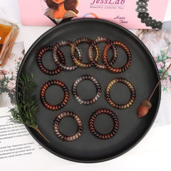 JessLab spiral hair tie withstands sweat and moisture for active days.
