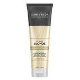 John Frieda Sheer Blonde activadora, botella visible para brillo en rubios claros.