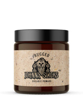 Johnny Slicks Oil Based Pomade tin close-up showing texture for easy styling.