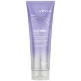 Joico Blonde Life Violet Conditioner bottle being poured to balance cool blonde tones.