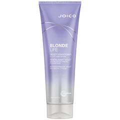 Joico Blonde Life Violet Conditioner bottle being poured to balance cool blonde tones.