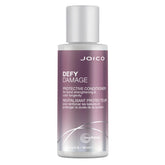 Botella de Joico Defy Damage Condicionador destaca hidratación suave para uso diario.