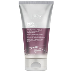 Joico Defy Damage Masque en envase transparente ofrece reparación de enlaces y protección de color.