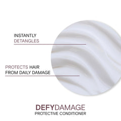 Creamy texture close-up of Joico Defy Damage Protective Conditioner showing rich moisture