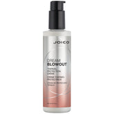 Joico Dream Blowout Cream bottle closeup for easy heat-protected styling.