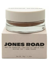 Jones Road What The Foundation beige bottle close-up shows creamy texture for natural coverage